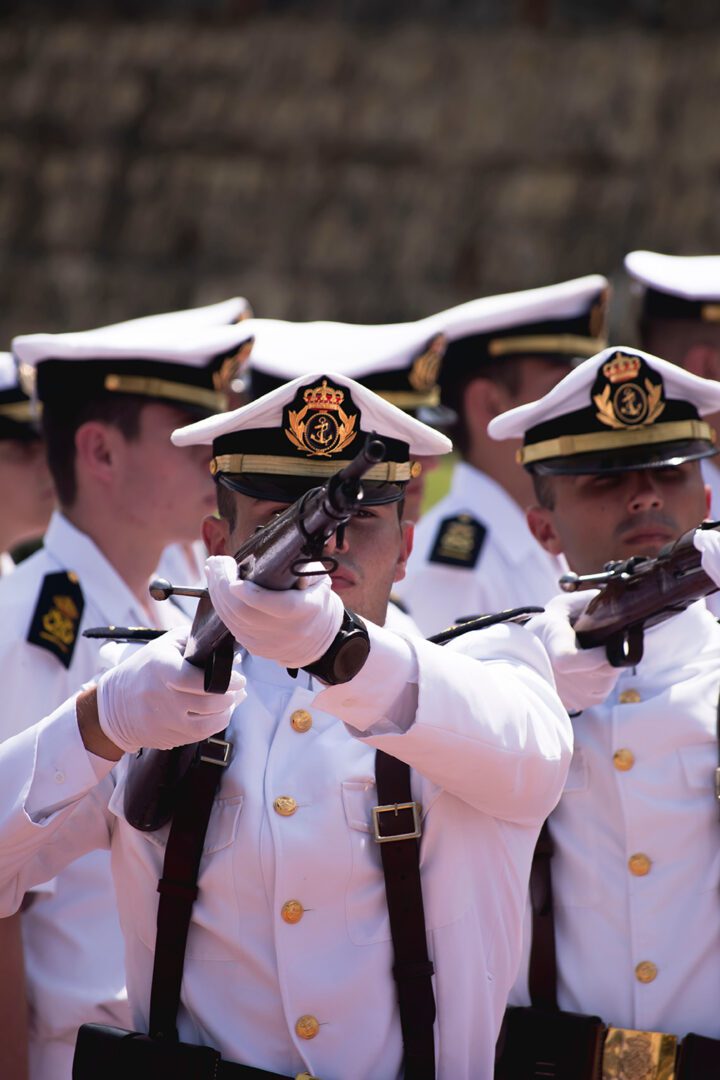 A group of people in uniform holding guns.